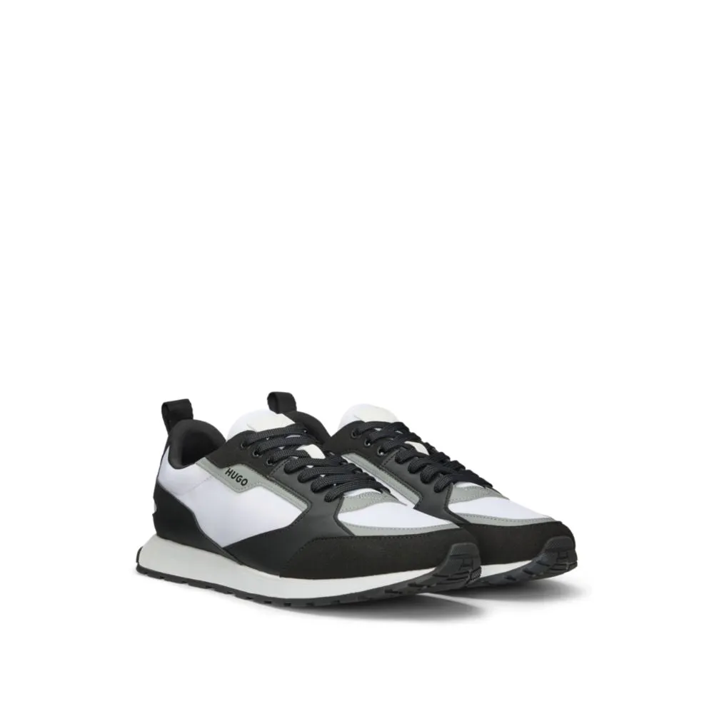 Mixed-material trainers with branded accents