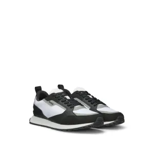 Mixed-material trainers with branded accents